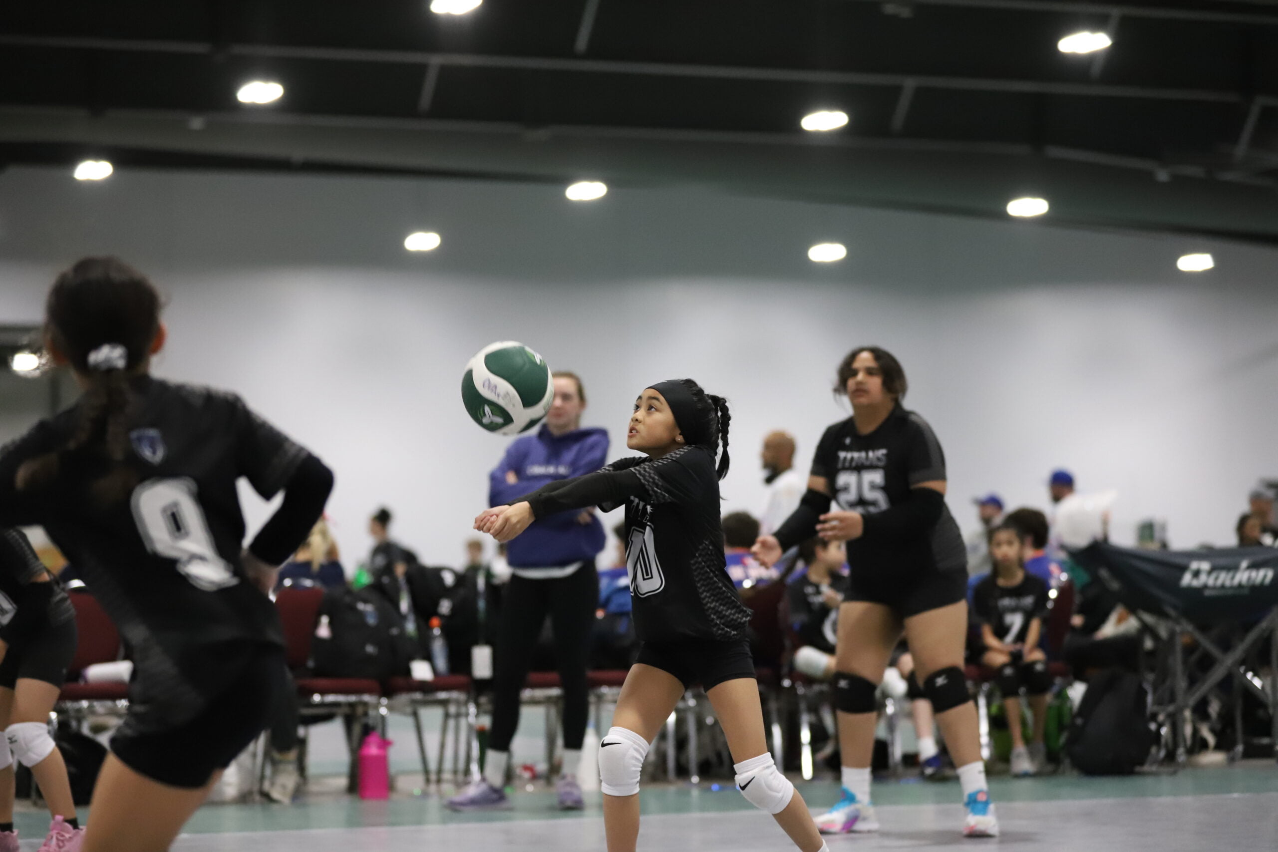 IMG_7534 A volleyball player spikes a ball at a volleyball clinic
